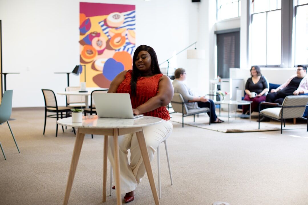 Diverse Brazilian team collaborating around a table in a bright office