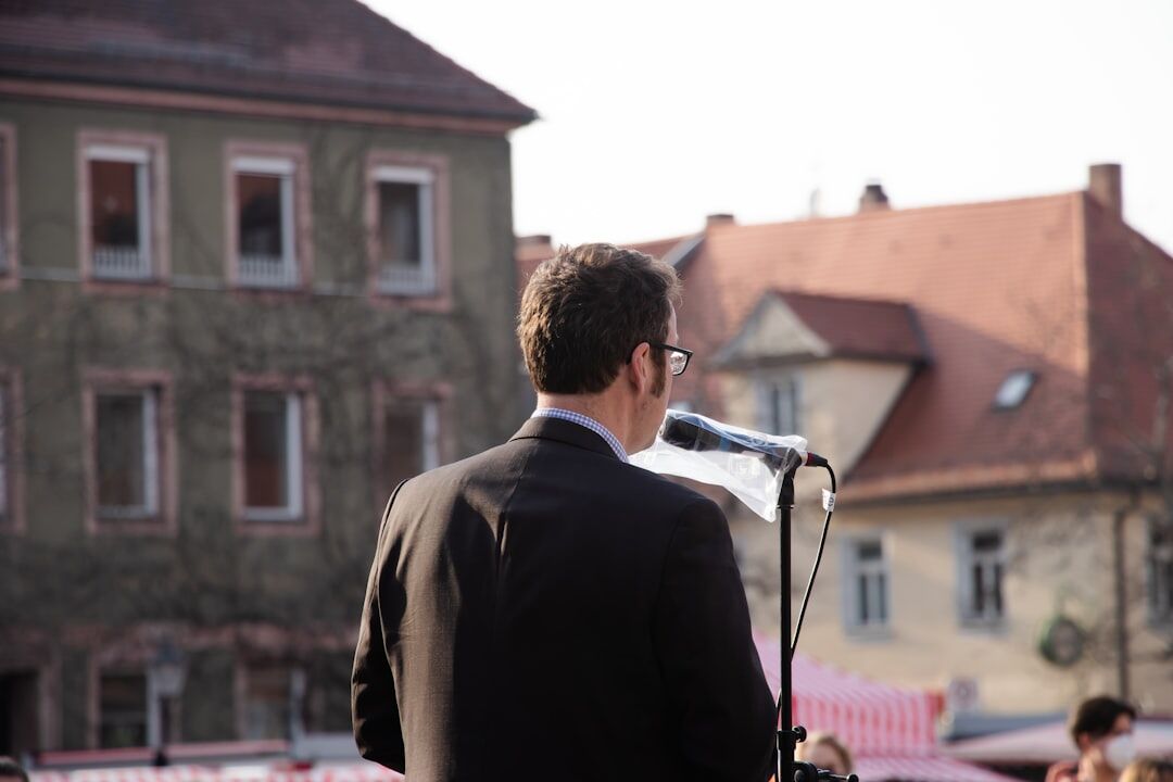 person giving speech on stage